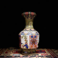 8 Chinese Porcelain hand-painted cloisonné vases including shipping.