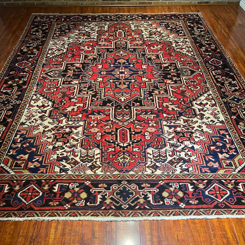 1950 PERSIAN HERIZ RUG 7’ 5” x 9’ 1” (LARG.61)