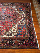 1950 PERSIAN HERIZ RUG 6’ 11” x 10’ 2” (LARG.FEA.60)