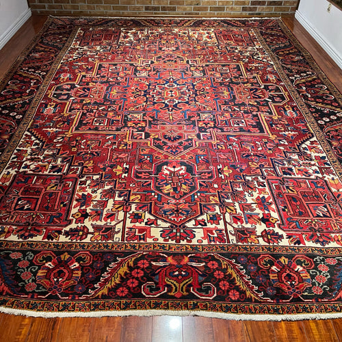 1950 PERSIAN HERIZ RUG 9’ 8” x 12’ 8” (LARG.36)