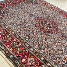 1970 PERSIAN MOOD RUG 5’ x 6’ 7” (MED.FEA.136)